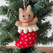 Handcrafted wool felt cat in a festive stocking — ethical, sustainable, and full of cozy charm on Christmas tree. 