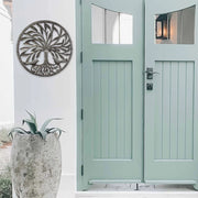 Artisan-crafted Tree of Life metal wall hanging symbolizing growth and harmony.