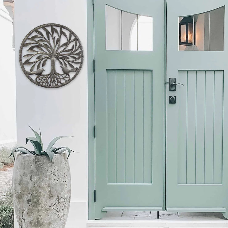 Artisan-crafted Tree of Life metal wall hanging symbolizing growth and harmony.