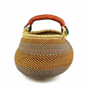 “Side view of Ghana handwoven Bolga basket, showcasing elephant grass weave and handle”