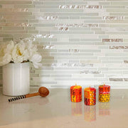 Trio of small artisan candles with colorful Zahabu-style motifs