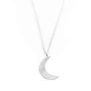 Silver-polished moon pendant close-up - ethical handmade jewelry