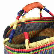 “Side view of Ghana handwoven Bolga basket, showcasing elephant grass weave and handle”