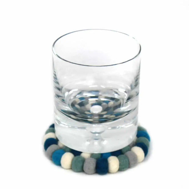 "Arctic blue handcrafted wool coasters on wooden table" 