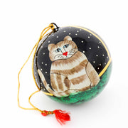 Close-up detail of hand-painted cat ornament showing fine brushwork christmas decor