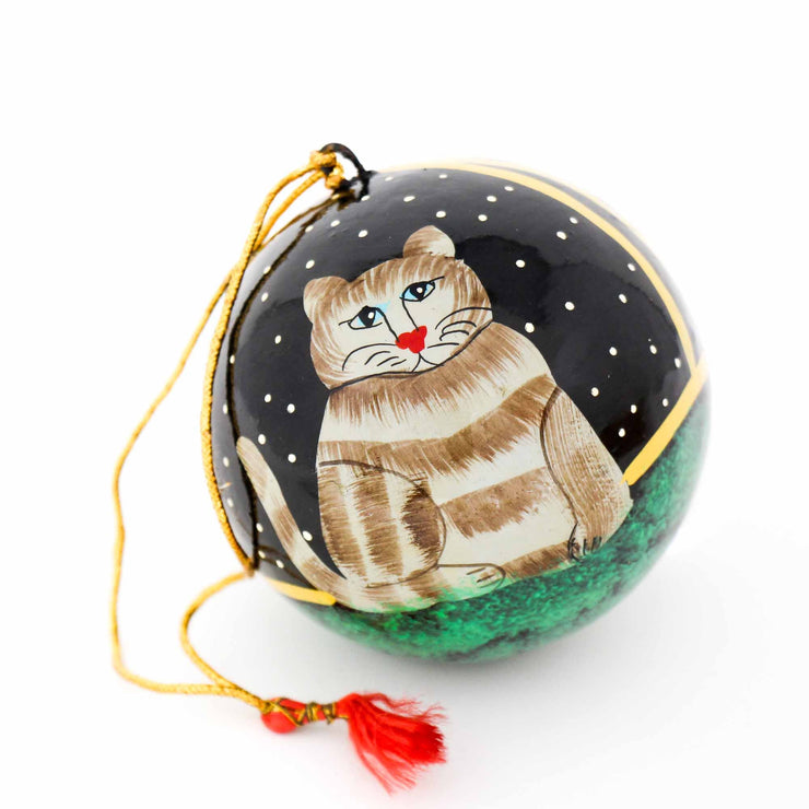 Close-up detail of hand-painted cat ornament showing fine brushwork christmas decor