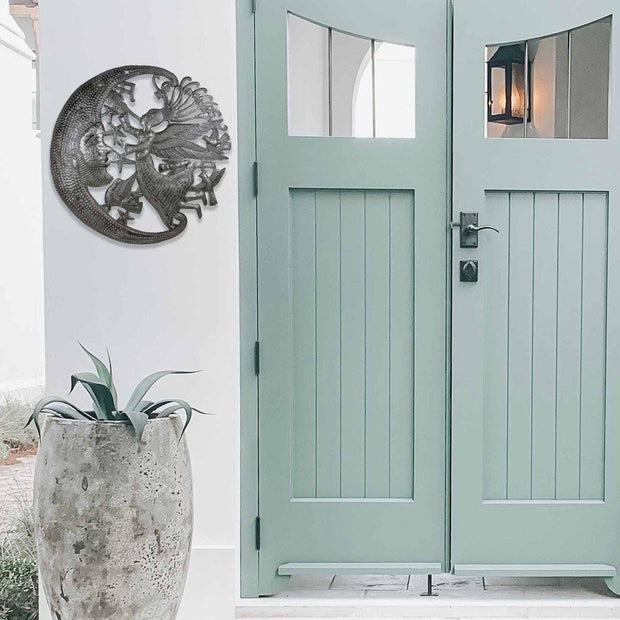 Traditional Haitian angel and moon wall sculpture, artisan-made from upcycled steel