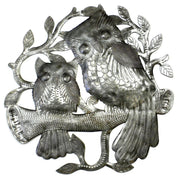 “pair of owls perched on a branch — handcrafted metal wall art from recycled steel drum”