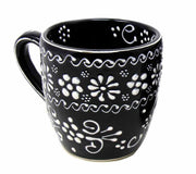 Side view of artisan Mexican pottery cups showing hand-painted texture