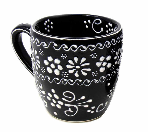 Side view of artisan Mexican pottery cups showing hand-painted texture